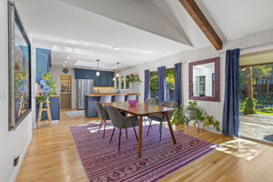 Dining room featuring hardwood floors, space for a full dining set, and patio door access to the back deck