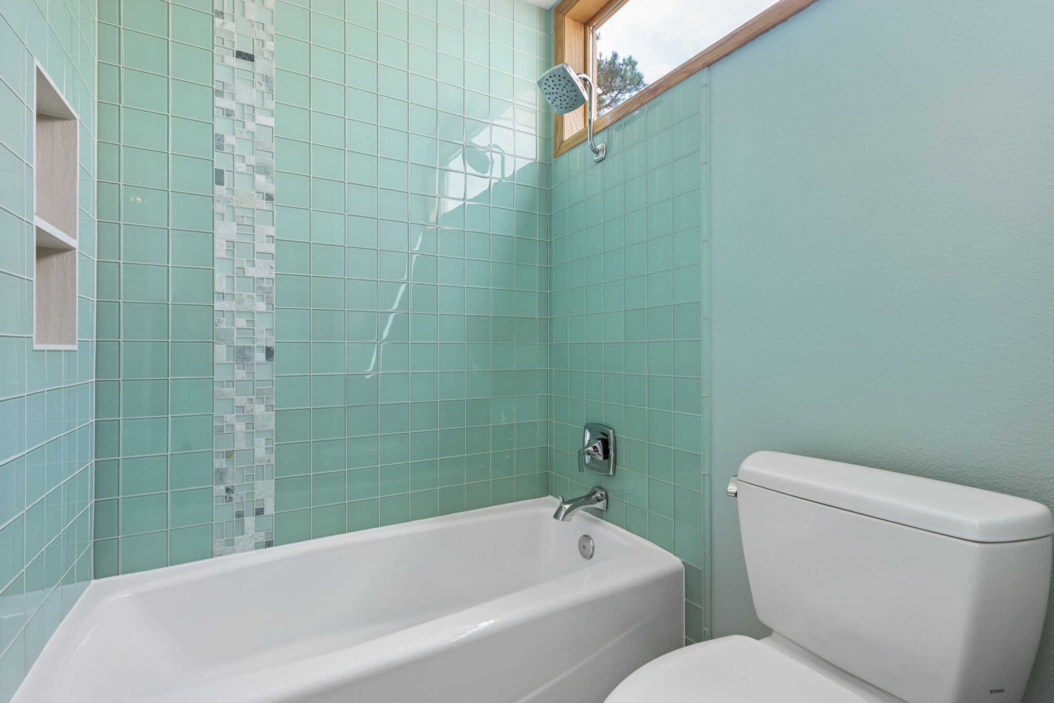 Main Bathroom featuring glass tiles.