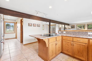 Kitchen pantry, desk, bath, and laundry are down the hall.