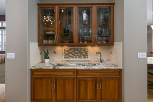 Great Room Wet Bar Features Granite Counter and Tile Details