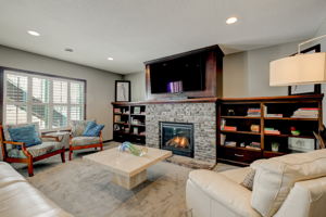 Lower Level Family Room With Gas Fireplace & Custom Built-Ins