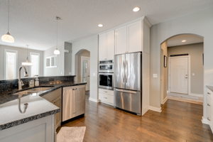 Kitchen With Granite Counters, SS Appliances and Pantry