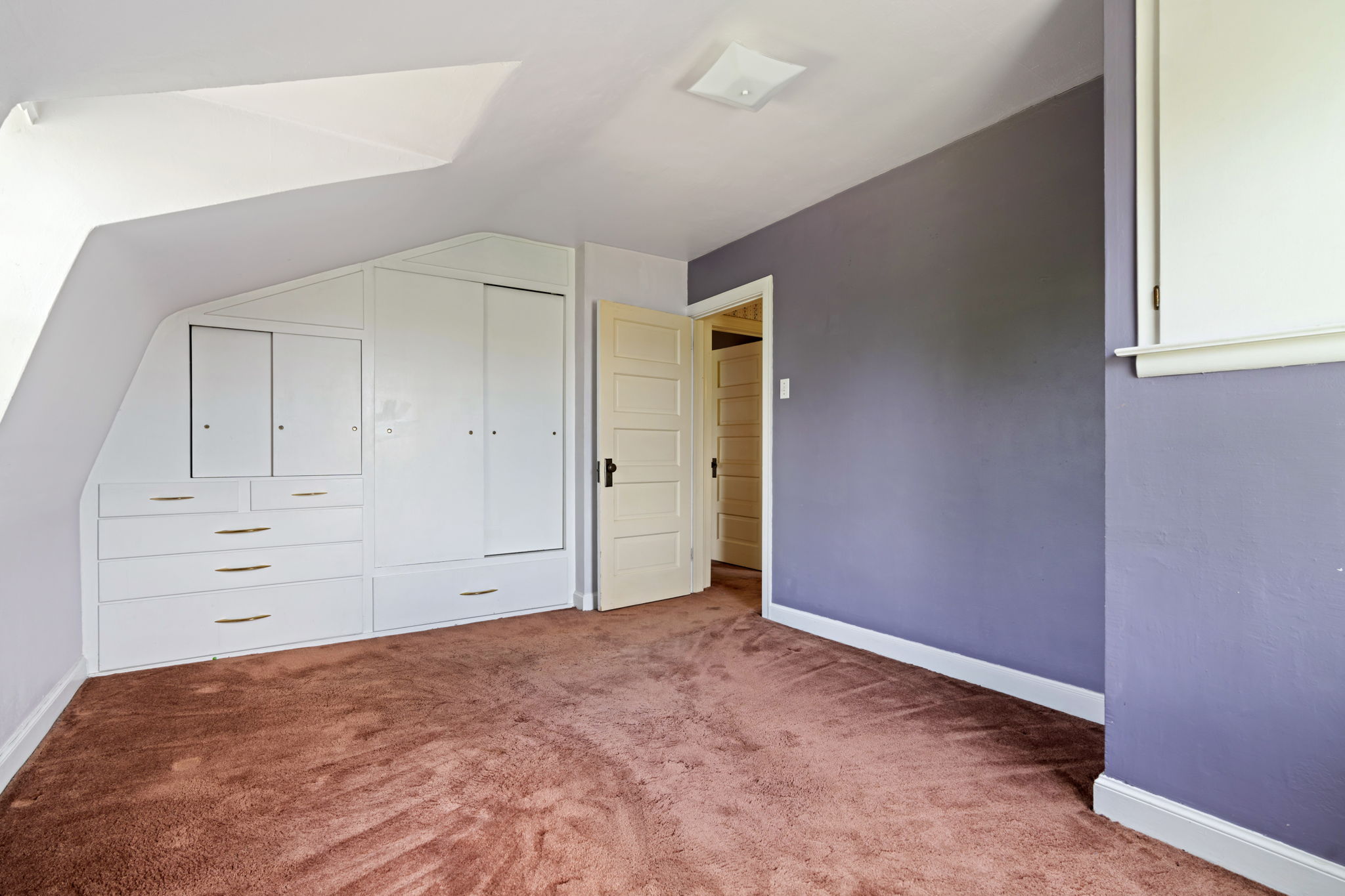 Upstairs bedroom with built-ins