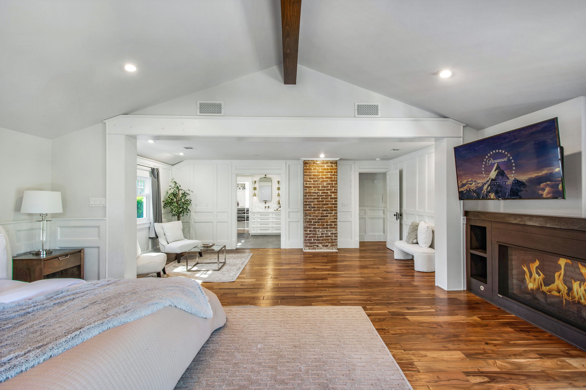 Vaulted ceilings & fireplace in primary suite
