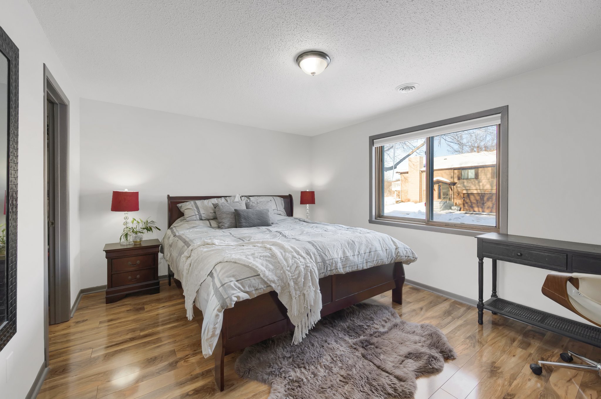 Spacious primary bedroom with ample natural light.