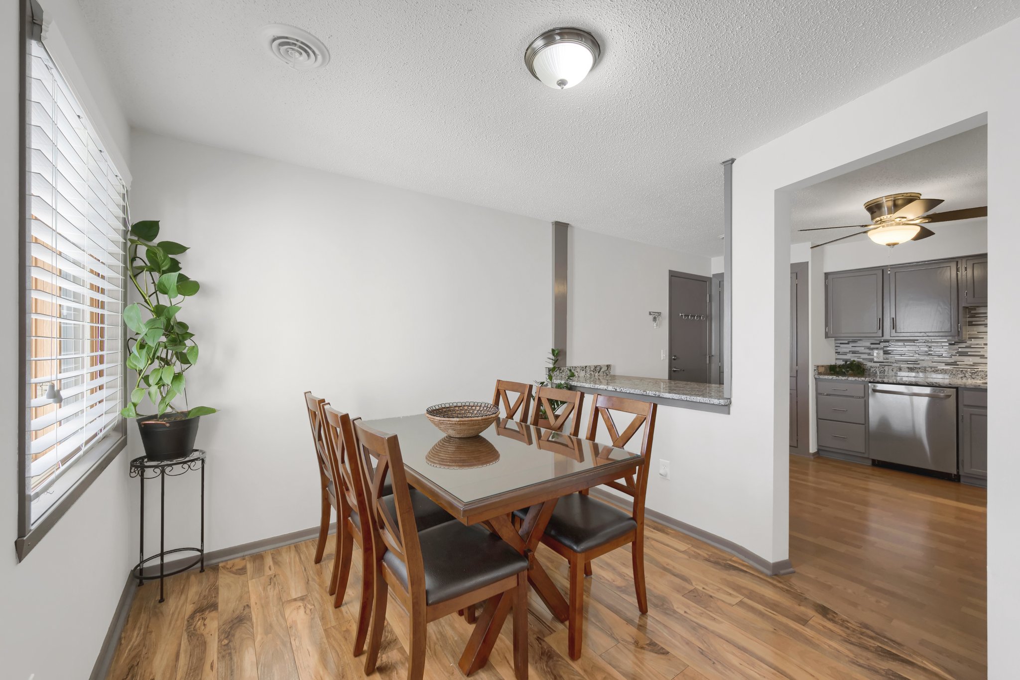 A bright dining room that seamlessly connects to the kitchen, creating an open-concept flow throughout the home!