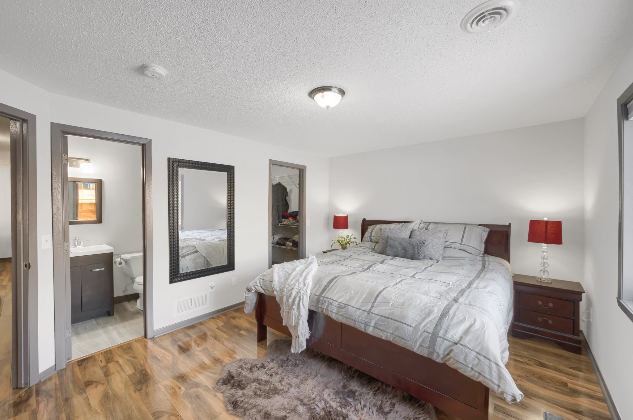 The primary bedroom features a private bath and a spacious walk-in closet for added convenience and privacy.