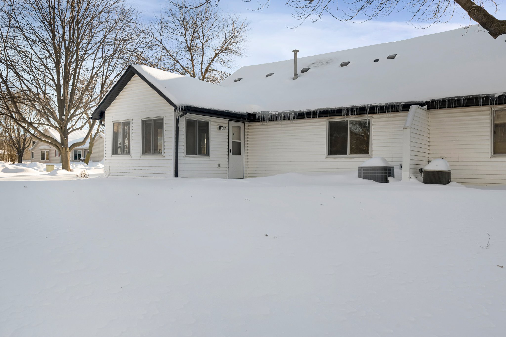 The home also features a back patio that offers a scenic view of the pond.