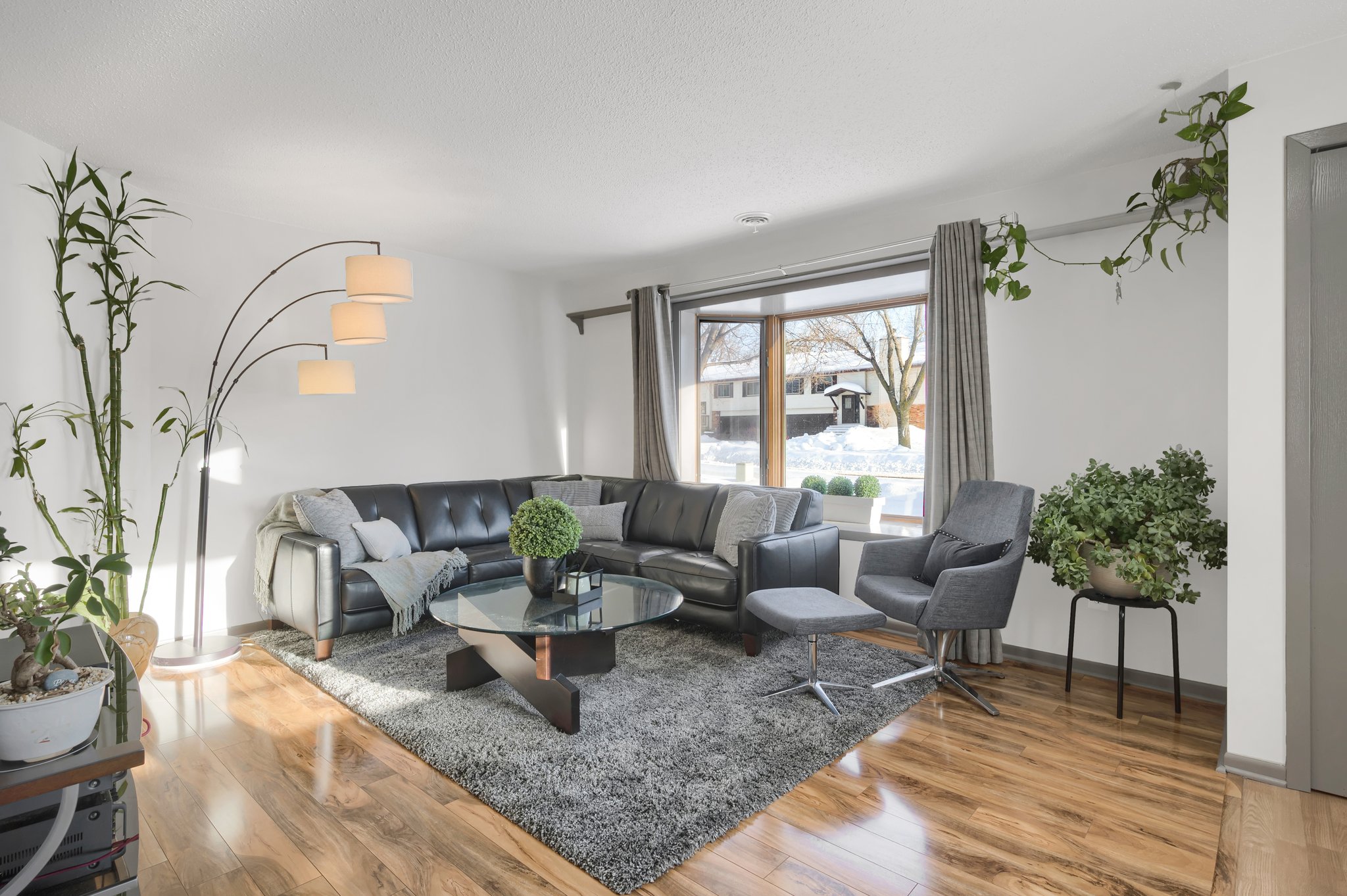 The living room boasts luxury vinyl plank flooring.