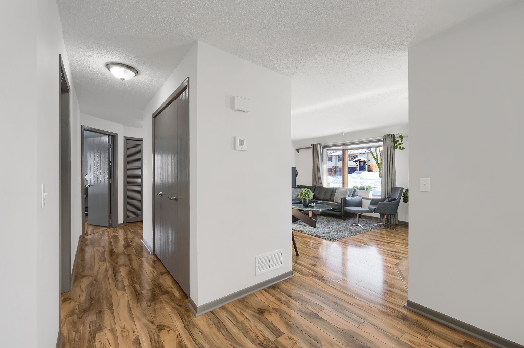 The gleaming LVT floors go throughout the home.