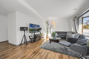 A spacious and airy living room that is filled with natural light!