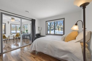 The second bedroom opens to the sunroom, offering a versatile space that could be used as an office or additional living area, providing endless possibilities..!