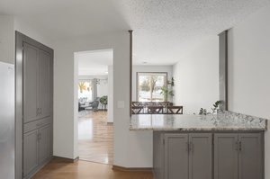 The kitchen seamlessly flows into the dining and living room and features a large peninsula..!