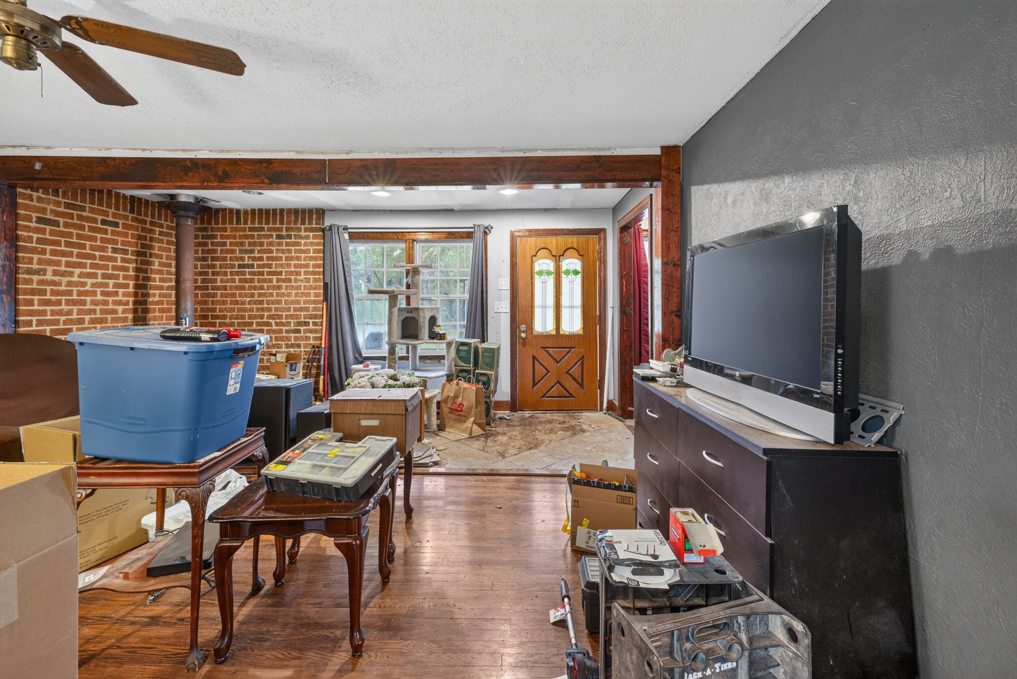 Area near the front door has concrete underneath as it used to be the front porch.