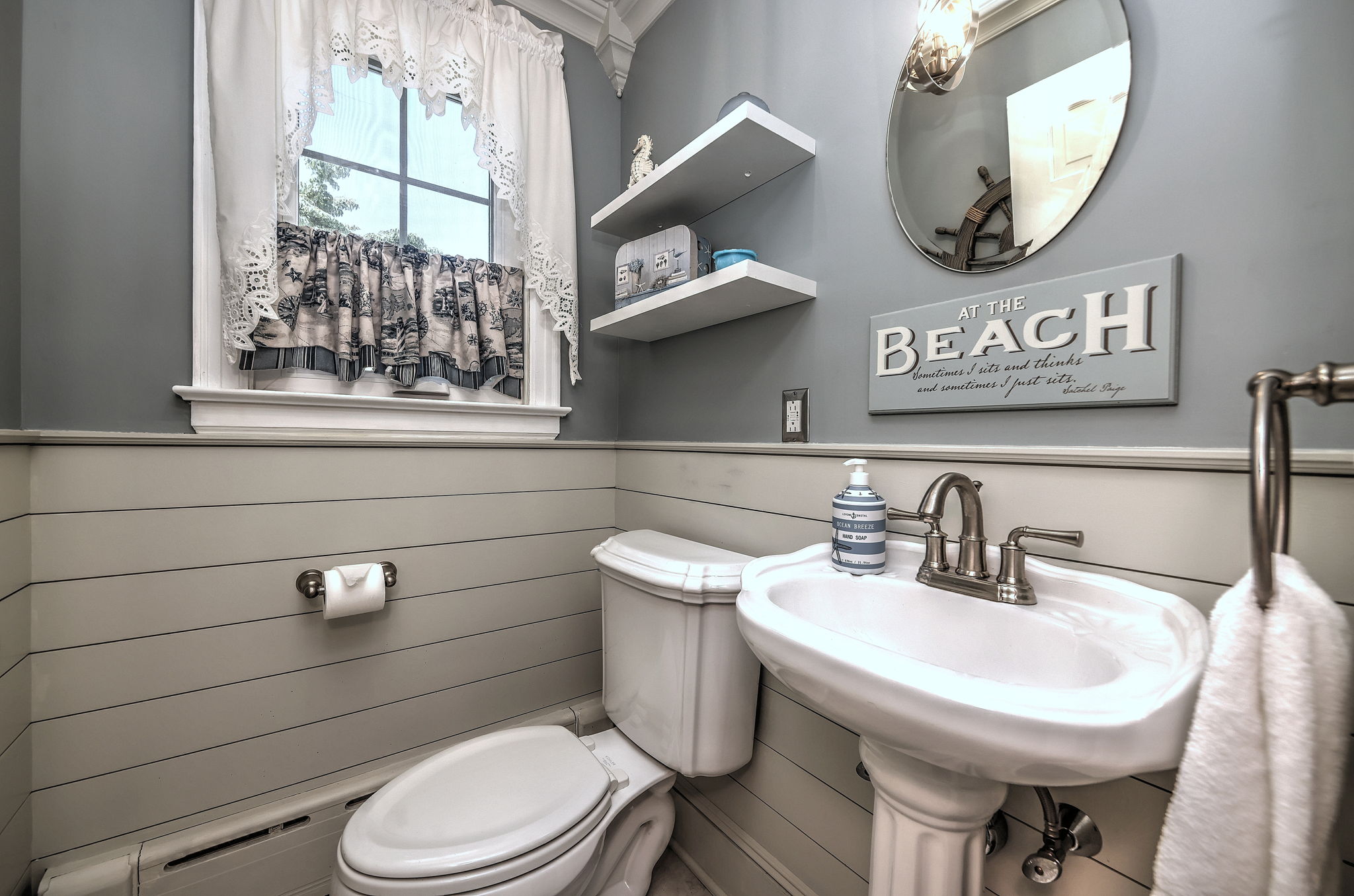 Beautifully Renovated Powder Room with Modern Finishes and Timeless Style.