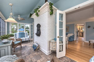 Wrapped in Windows and Overlooking the Gardens, the Sun Room Creates a Bright, Inviting Space for Relaxing and Enjoying the Changing Seasons.