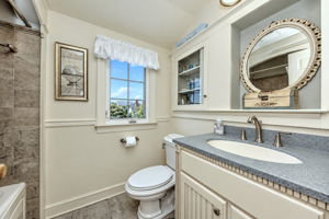 Hall Bath – Beautiful Tilework and Built-In Cabinetry.