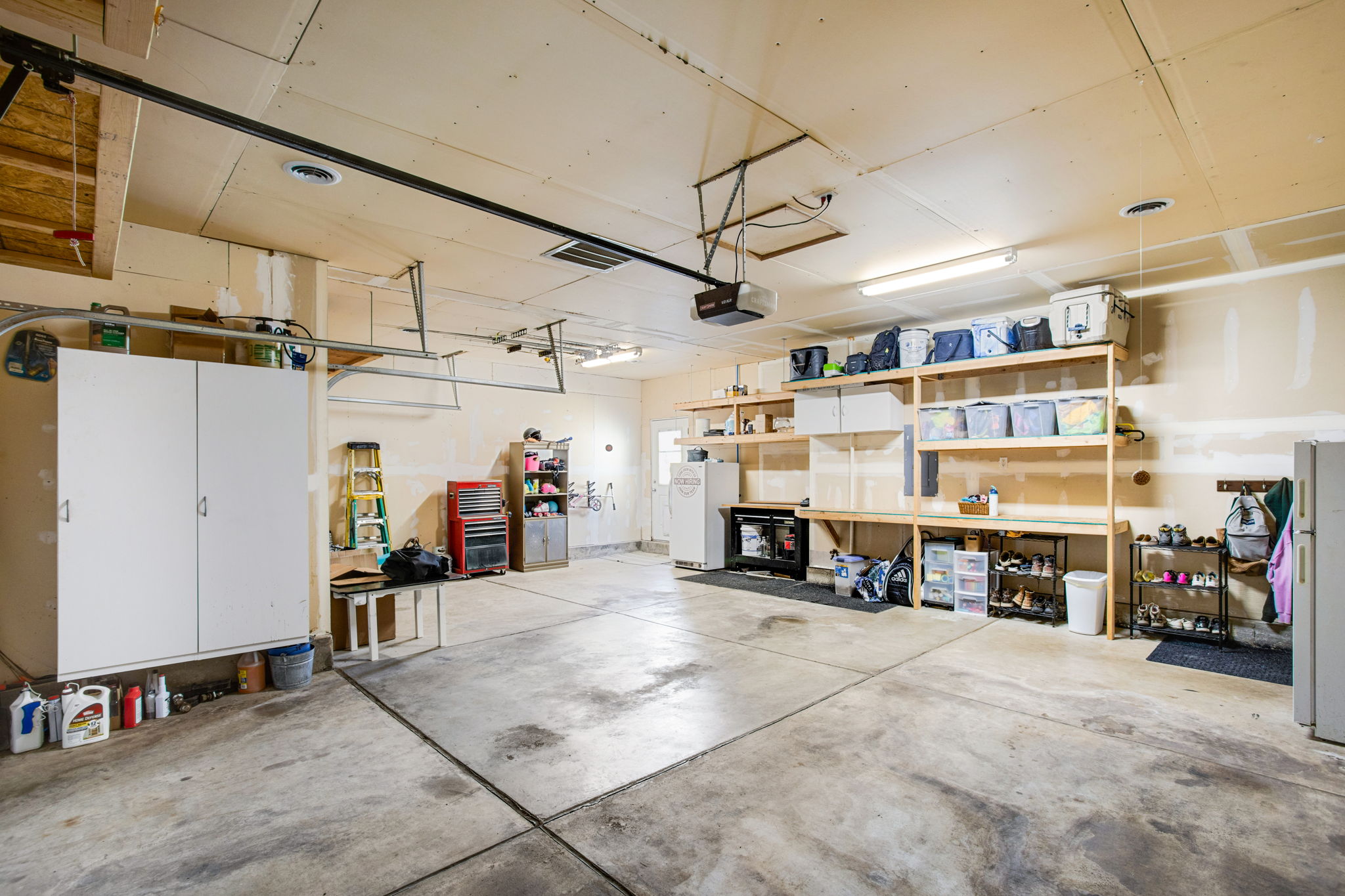 HEATED GARAGE WITH BUILT-IN WORKBENCH AND SHELVING