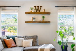 LARGE WINDOWS LOOKING INTO BACK YARD FROM GREAT ROOM