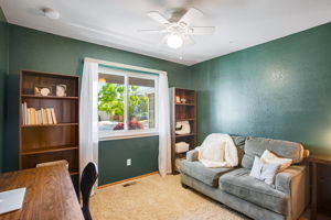 BEDROOM #2 WITH LARGE WINDOW LOOKING TO FRONT YARD