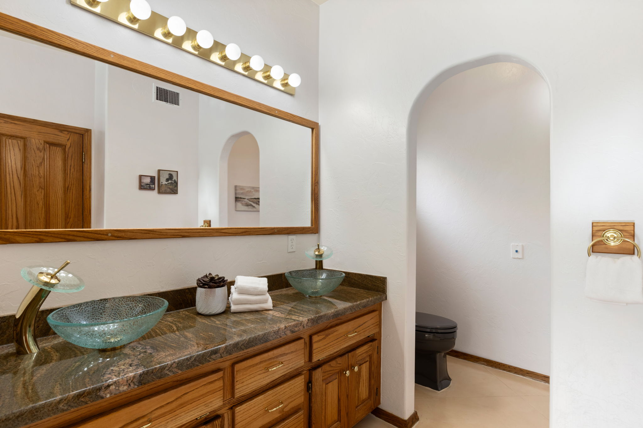 Primary Bathroom with raised glass bowl sinks