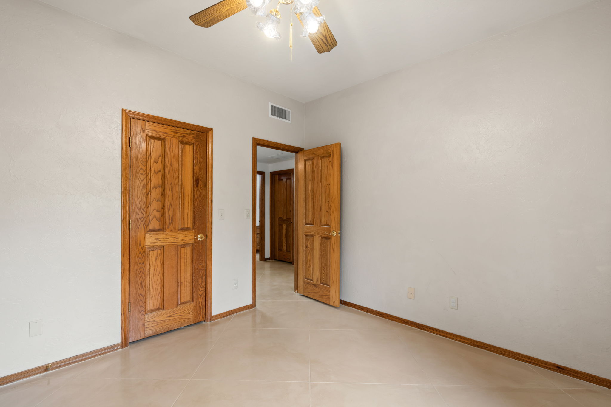 Bedroom 3 with ceiling fan/walk-in closet