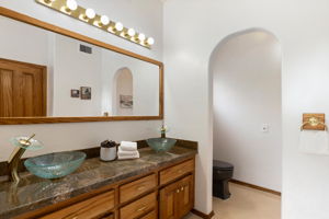 Primary Bathroom with raised glass bowl sinks