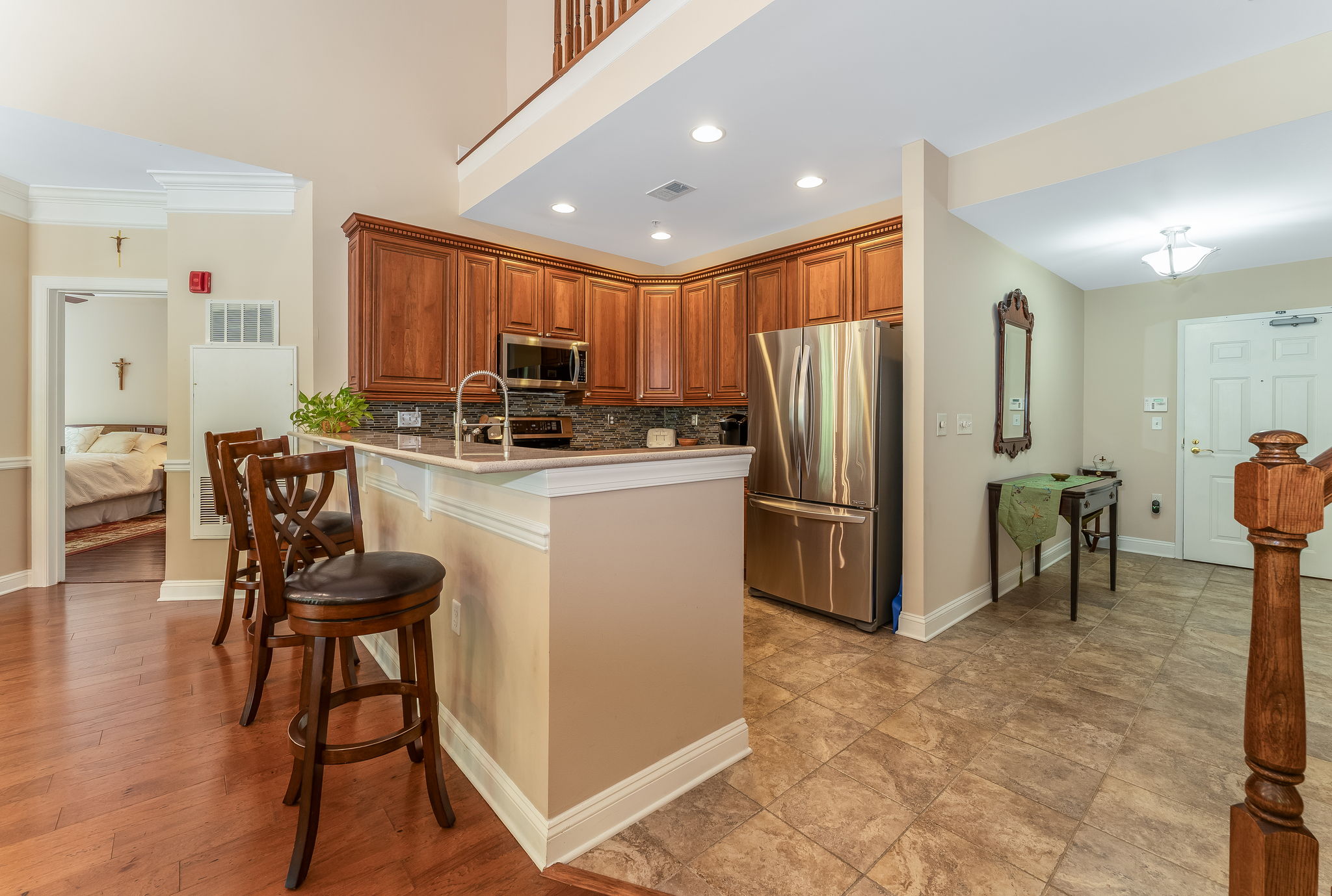 Foyer and Kitchen A raised granite breakfast bar with seating invites casual dining.