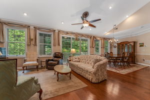 Great Room A soaring ceiling enhances the open and airy great room, where beautiful hardwood floors and recessed lighting define the living and dining areas.