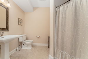 Full Hall Bath The hall bath features a pedestal sink, tub-shower in tile surround and ceramic tile floor.