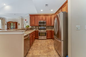 Kitchen Abundant storage for dishware, linens, and small appliances in the butler?s pantry with white cabinetry and granite countertops. (not shown)