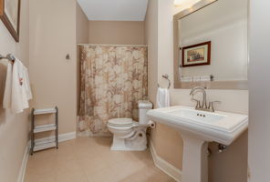 Bathroom 3 The en suite bath features a pedestal sink, tub-shower in tile surround and ceramic tile floor.