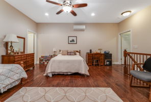 Balcony A full wall of windows & sliding doors fill the space w natural light & open to a private balcony overlooking a peaceful wooded setting.