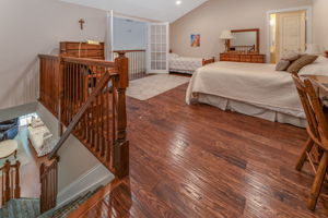 Bedroom 3 This spacious bedroom, complete with a walk-in closet and en suite bath, features French doors that open to a Juliette balcony overlooking the great room below. Other features include re-cessed lighting, ceiling fan and hardwood flooring.