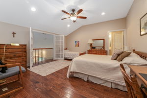 Bedroom 3 This spacious bedroom, complete with a walk-in closet and en suite bath, features French doors that open to a Juliette balcony overlooking the great room below. Other features include re-cessed lighting, ceiling fan and hardwood flooring.