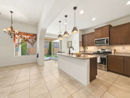 View from Living Room looking towards sliding  glass doors to the side yard.