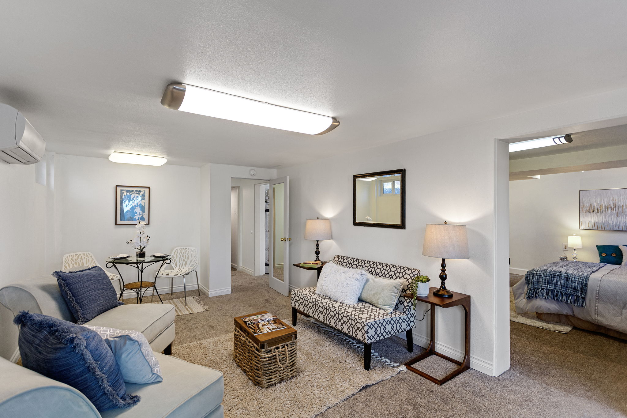 There’s room here for distinct living and dining areas, with the bedroom opening directly off the main gathering space.