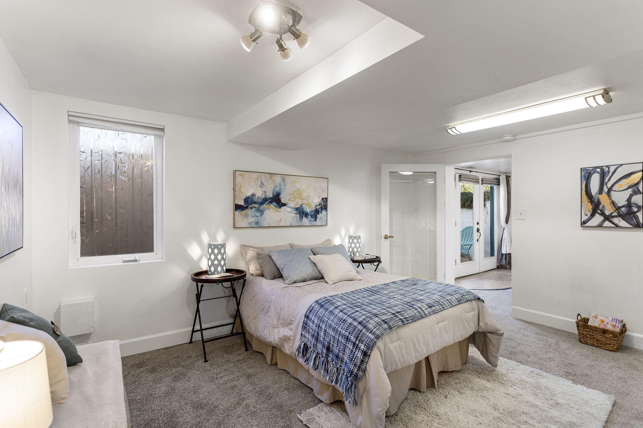 Room for a king: this bedroom has brand-new carpet and padding, generous closet space, plus an oversized stepped window well that brings in abundant daylight and adds to the room’s open feel.