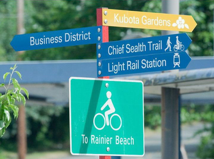 Neighborhood wayfinding points the way to Kubota Garden, the Rainier Beach business district, Chief Sealth Trail and Link light rail.