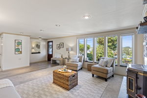 A wall of windows brings in abundant natural light and keeps the front garden in view from the main living room.
