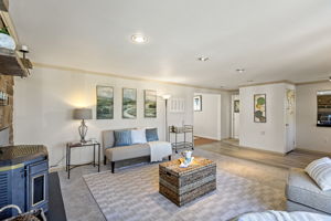 A front entry with coat closet gives you real arrival space, while the main level opens easily from living room toward dining and kitchen—making the floor plan feel broader than the exterior suggests.