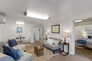 There’s room here for distinct living and dining areas, with the bedroom opening directly off the main gathering space.