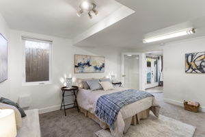 Room for a king: this bedroom has brand-new carpet and padding, generous closet space, plus an oversized stepped window well that brings in abundant daylight and adds to the room’s open feel.
