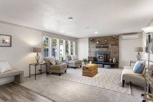 A wall of windows brings in abundant natural light and keeps the front garden in view from the main living room.