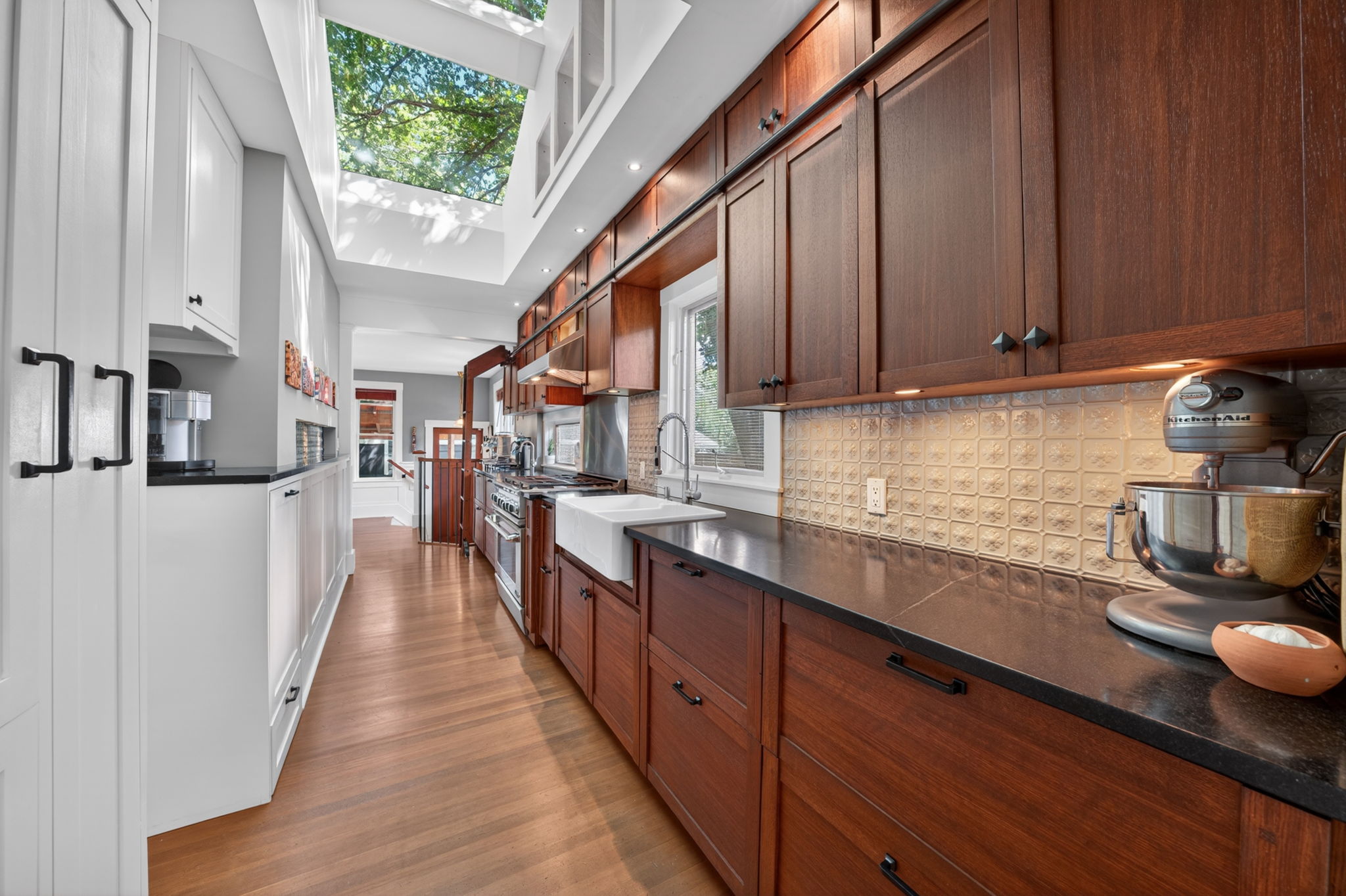Custom kitchen with a 36 DCS gas range, Sub-Zero refrigeration and twin skylights