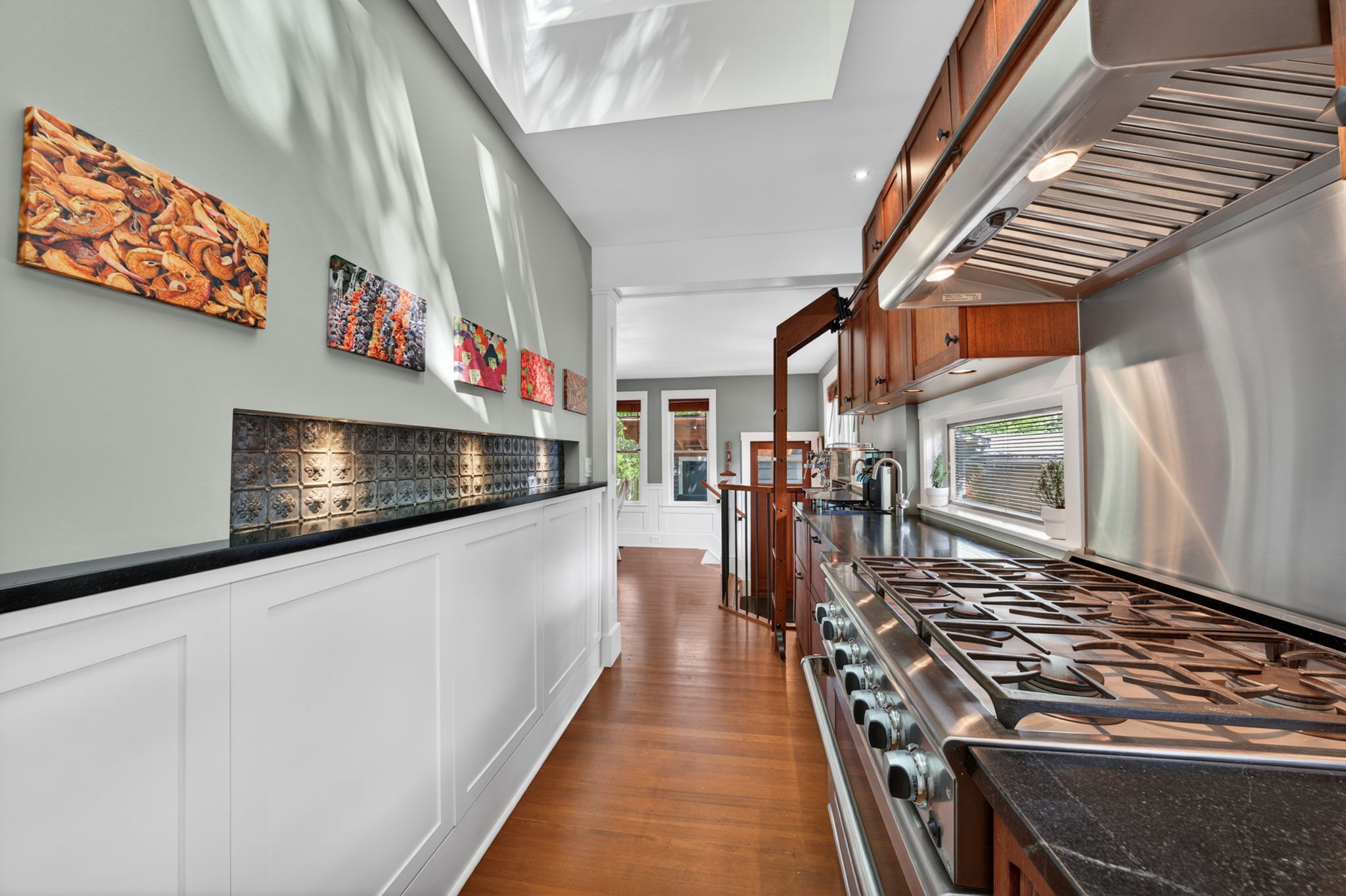 Custom kitchen with a 36 DCS gas range, Sub-Zero refrigeration and twin skylights