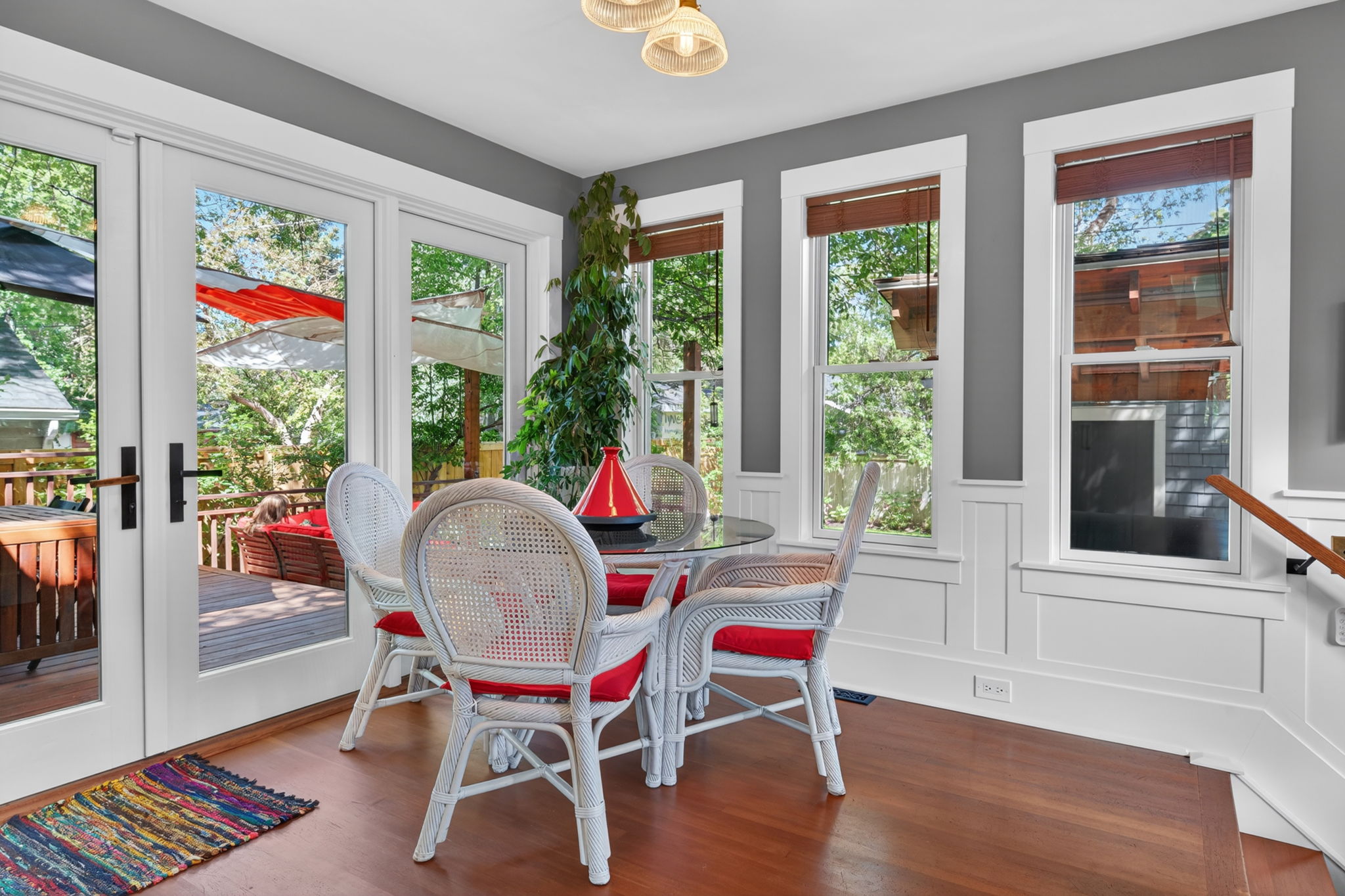 Glassed-in breakfast nook opening straight onto the deck