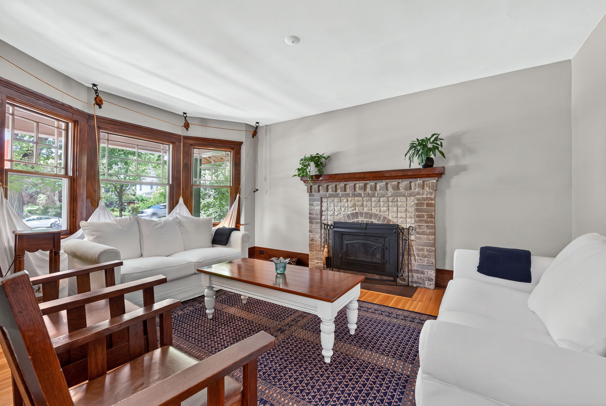 Jotul insert set into the living room's original brick fireplace