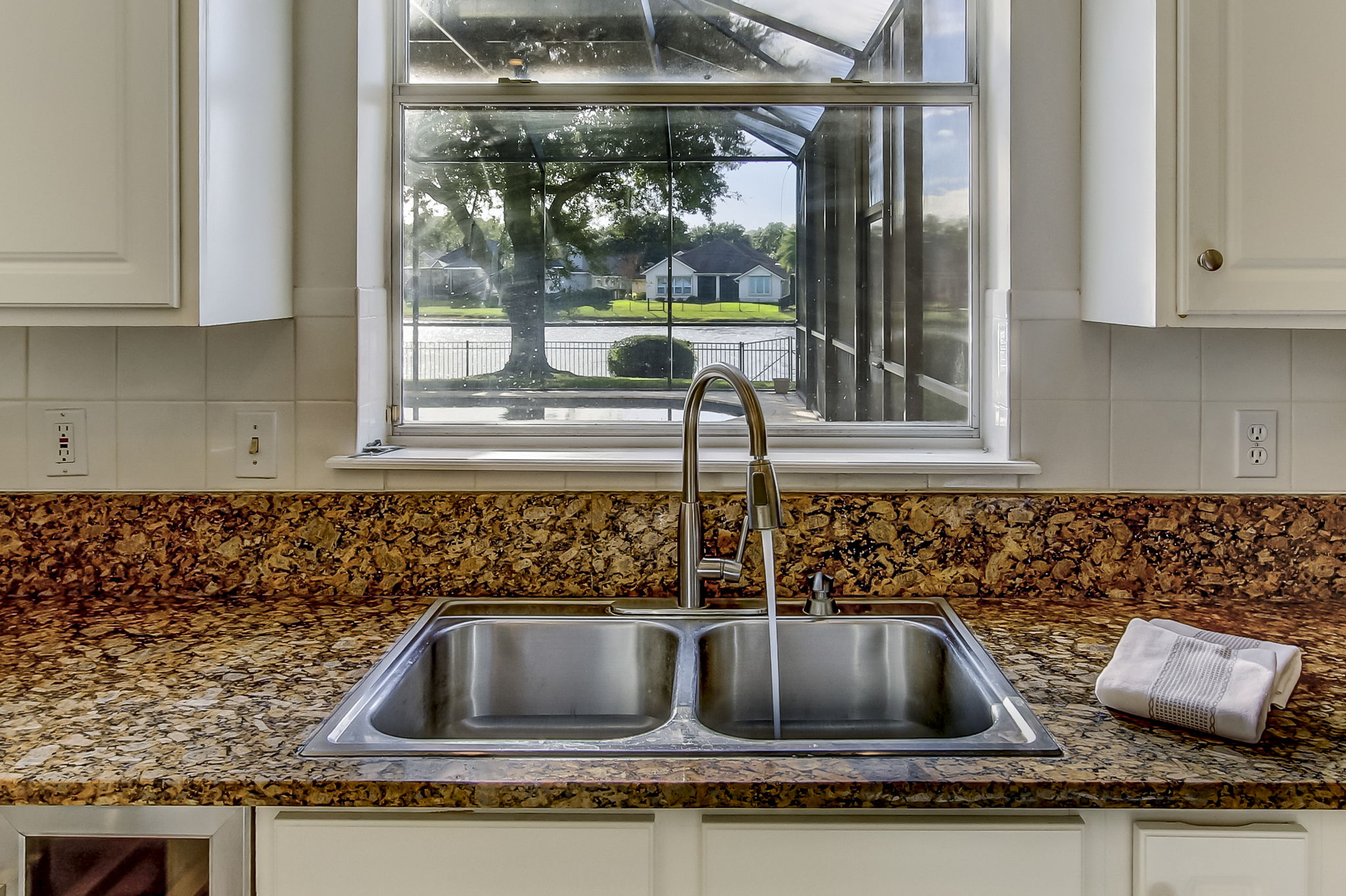 View of Pool & Lake from Kitchen