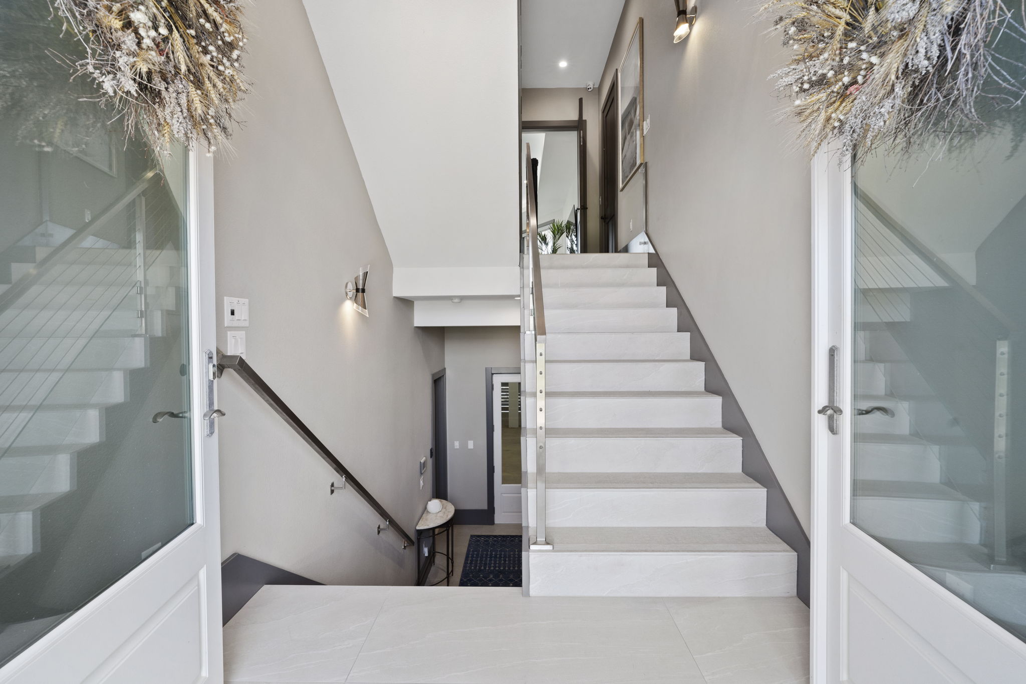 Grand entrance w/ double doors.